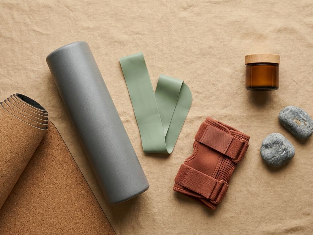 Cork mat, foam roller and knee support on linen